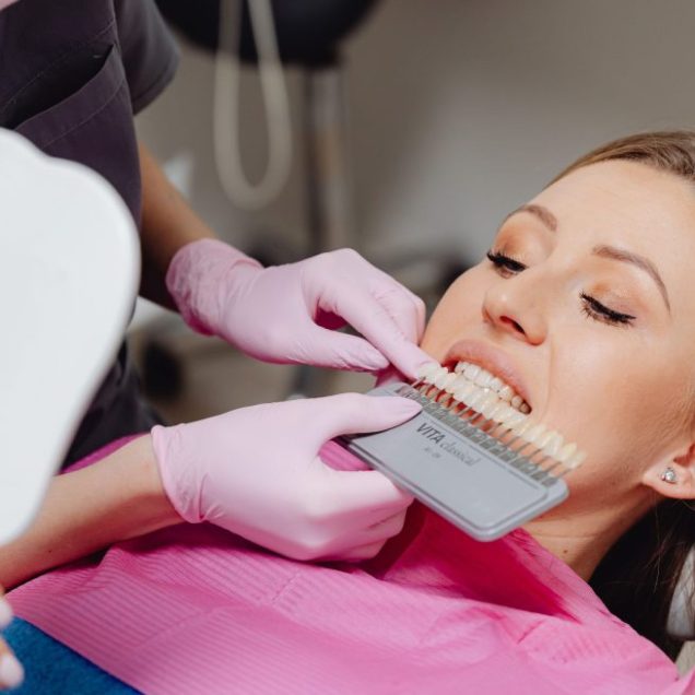 A patient having professional teeth whitening carried out at a dental office