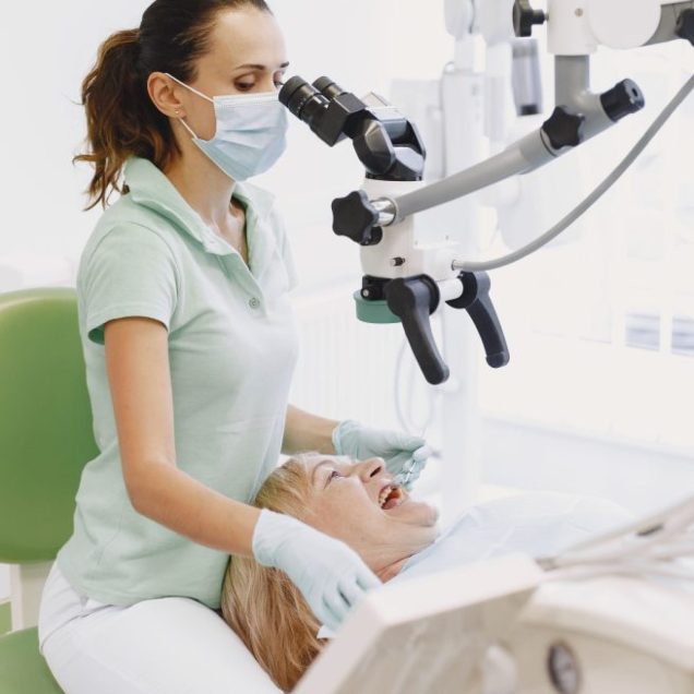 A patient being treated comfortably in a modern dental office
